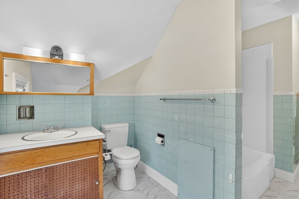 264 Sumner Avenue Springfield, MA 01108 - Photo 21 of 32 a bathroom with a sink a toilet and shower