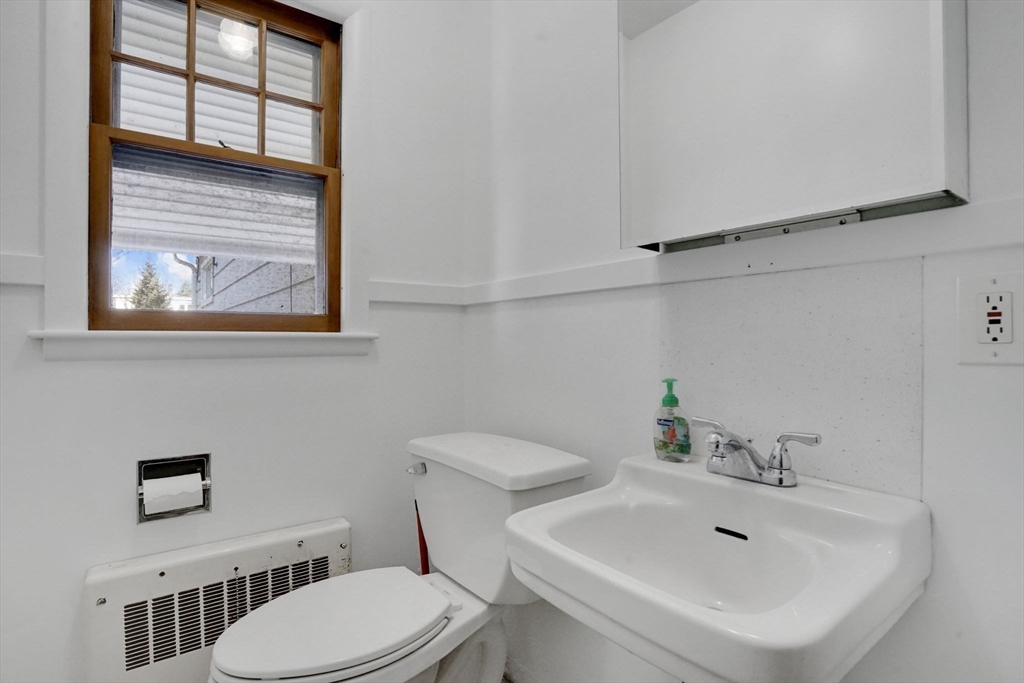 264 Sumner Avenue Springfield, MA 01108 - Photo 29 of 32 a bathroom with a sink mirror and toilet