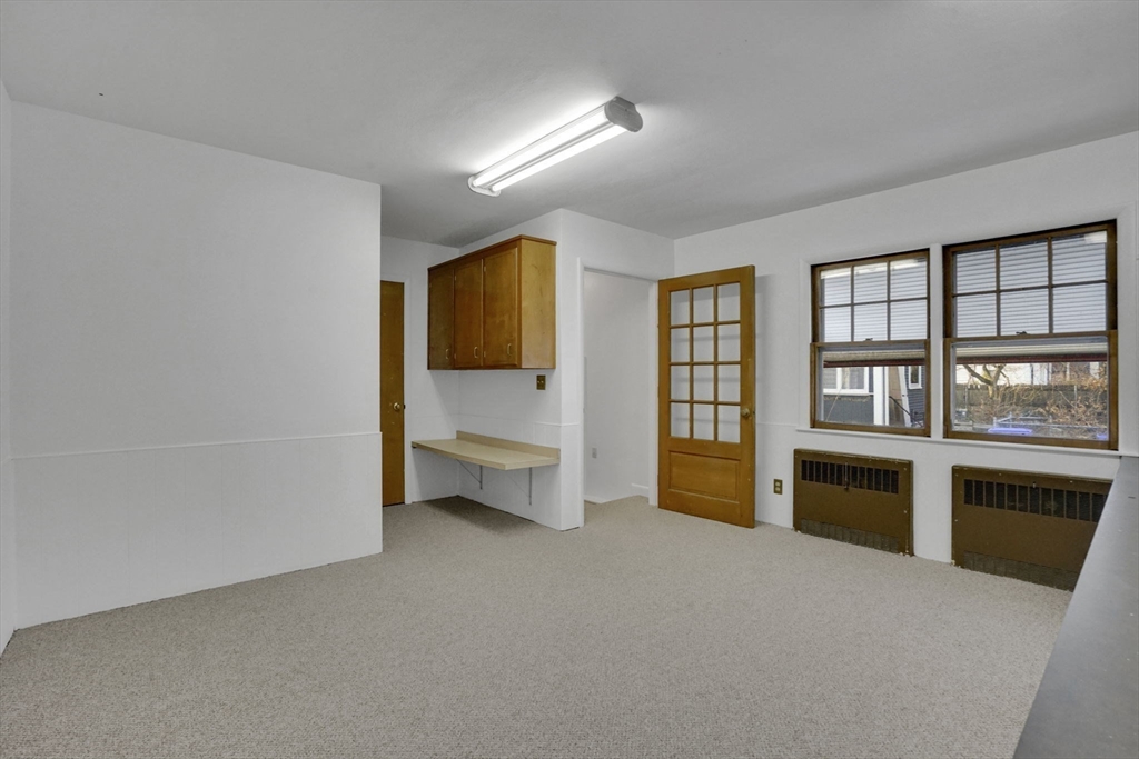 264 Sumner Avenue Springfield, MA 01108 - Photo 30 of 32 a big room with windows and cabinet