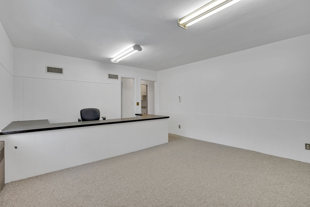 264 Sumner Avenue Springfield, MA 01108 - Photo 31 of 32 a living room with a wooden floor