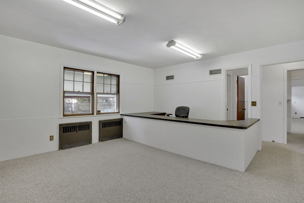 264 Sumner Avenue Springfield, MA 01108 - Photo 32 of 32 a living room with stainless steel appliances kitchen island granite countertop a stove and a refrigerator