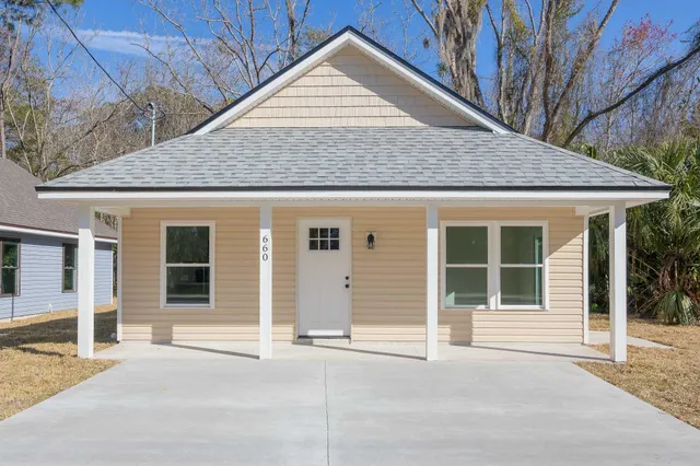 a house with trees in the background