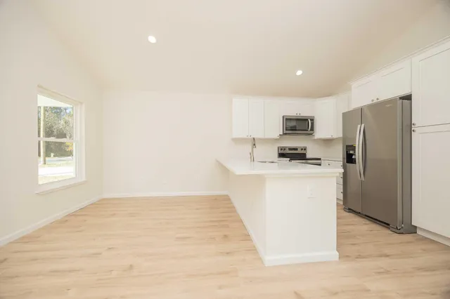 a view of a room with shelf on the wall
