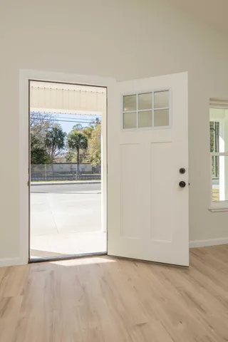 a view of kitchen with stainless steel appliances a refrigerator and a sink