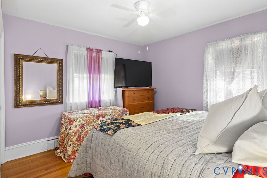 9500 West Providence Road Chesterfield, VA 23236 - Photo 20 of 39 a bedroom with a bed and a chandelier