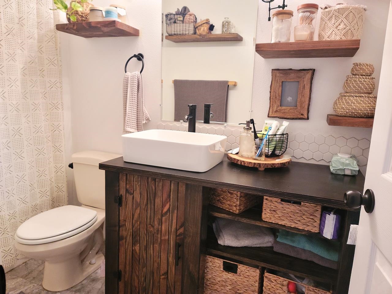 88 Kamalii Place Haiku, HI 96708 - Photo 22 of 24 a bathroom with a sink a toilet and a mirror