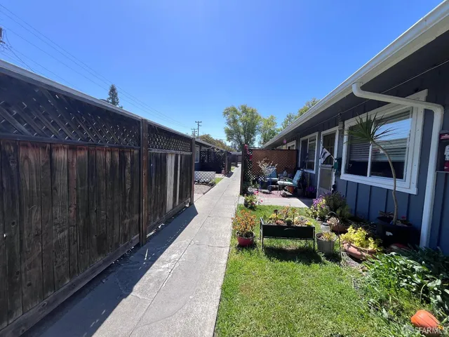 a view of yard with patio