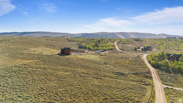 61 Skyline, Unit 61 Helper, UT 84526 - Photo 19 of 31 Expansive natural landscape with rolling terrain and scattered evergreen trees