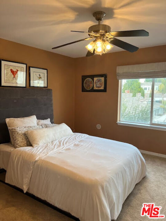 182 Comanche Topanga, CA 90290 - Photo 12 of 24 a bedroom with a bed and a chandelier