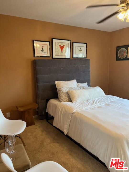 182 Comanche Topanga, CA 90290 - Photo 13 of 24 a bed sitting in a bedroom and painting on the wall