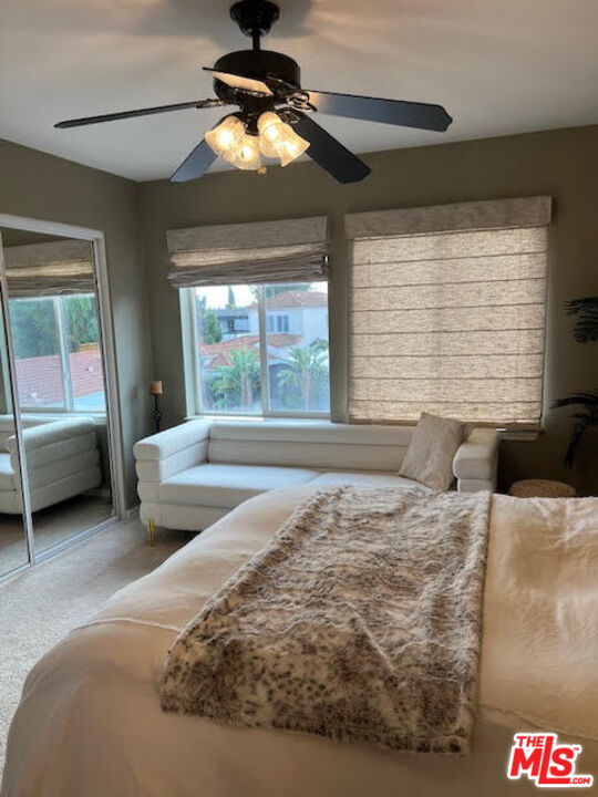 182 Comanche Topanga, CA 90290 - Photo 14 of 24 a bedroom with a bed and a chandelier