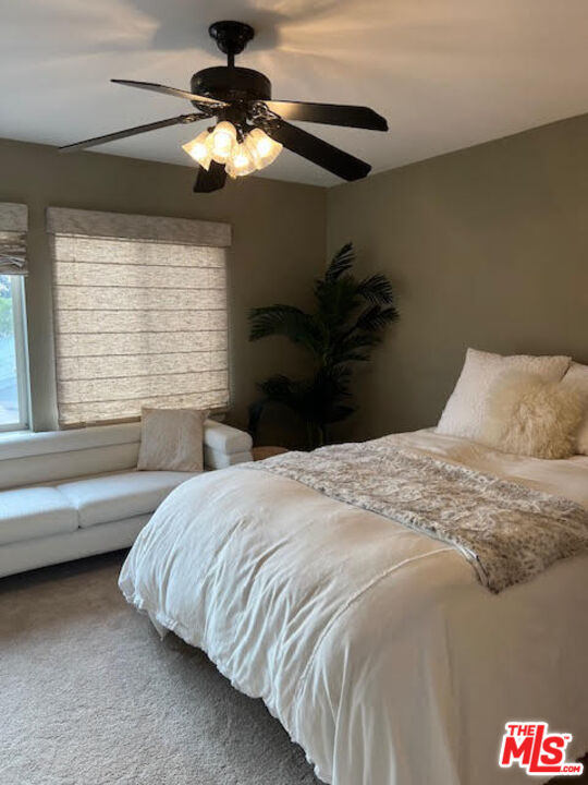 182 Comanche Topanga, CA 90290 - Photo 15 of 24 a bedroom with a bed and a chandelier