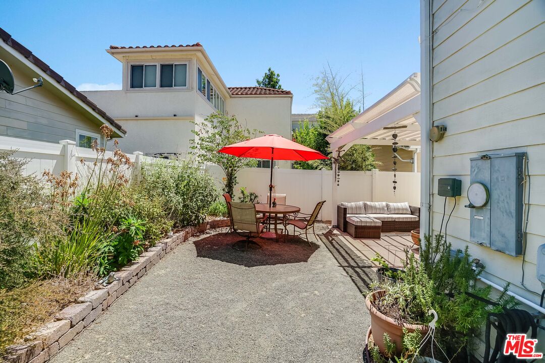 182 Comanche Topanga, CA 90290 - Photo 18 of 24 an outdoor space with patio furniture and white umbrellas
