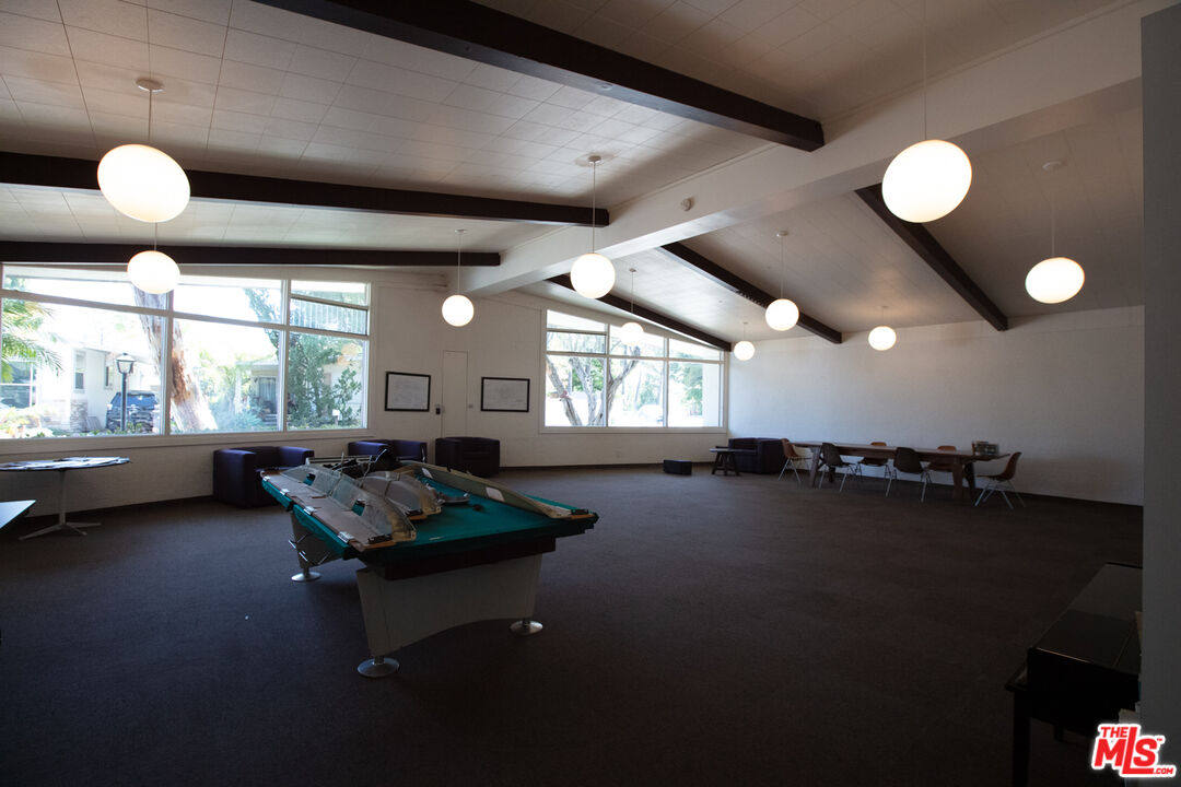 182 Comanche Topanga, CA 90290 - Photo 20 of 24 a living room with furniture and a large window