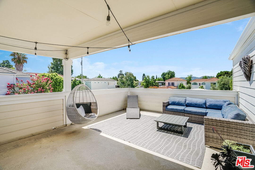 182 Comanche Topanga, CA 90290 - Photo 2 of 24 a roof deck with a couch and potted plants