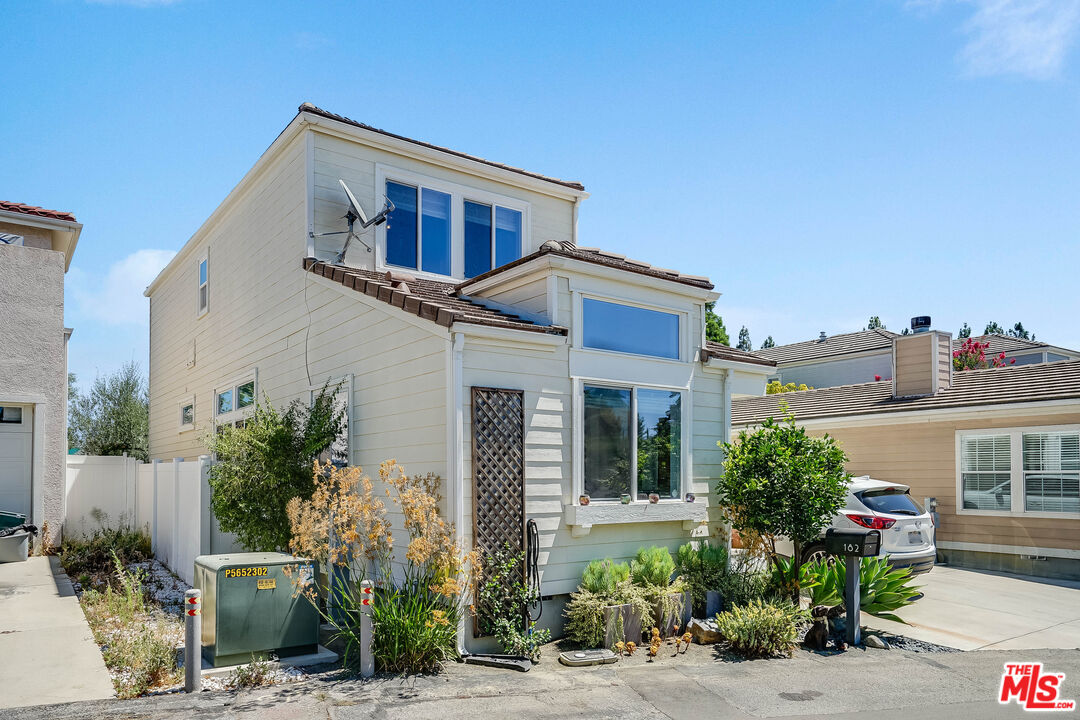 182 Comanche Topanga, CA 90290 - Photo 23 of 24 a front view of a house with a yard