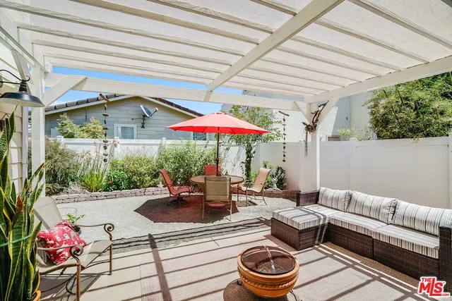 a outdoor space with patio table and chairs