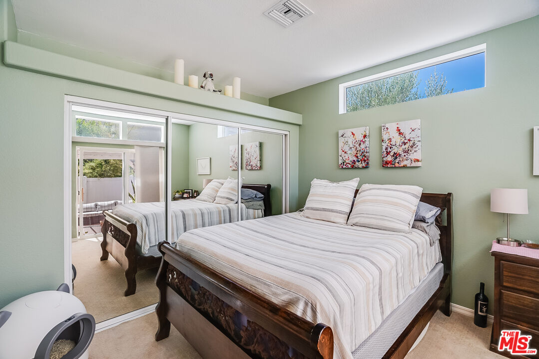 182 Comanche Topanga, CA 90290 - Photo 9 of 24 a bedroom with a bed and a table