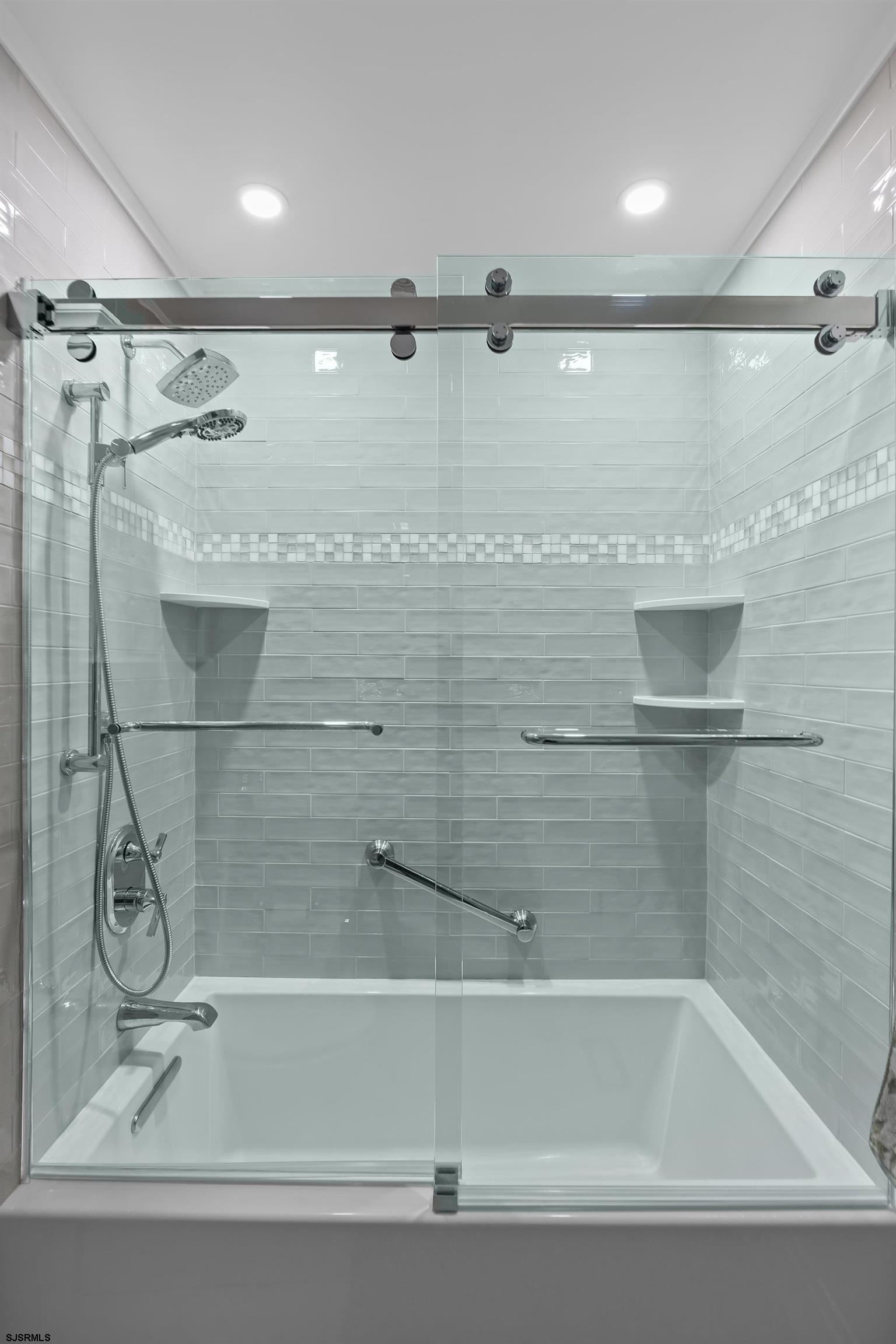 405 Atlantic Avenue, Unit 1 Ocean City, NJ 08226 - Photo 30 of 39 a bathroom with a shower and a bathtub