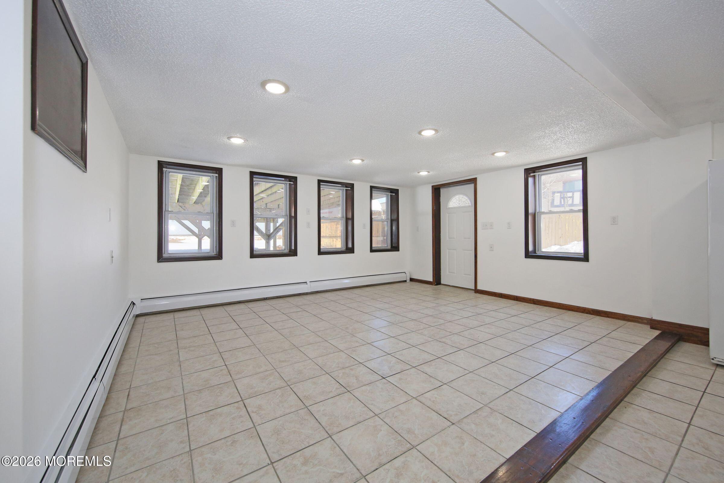 60 Matthew Street, Unit 1 Highlands, NJ 07732 - Photo 5 of 33 a view of an empty room and window