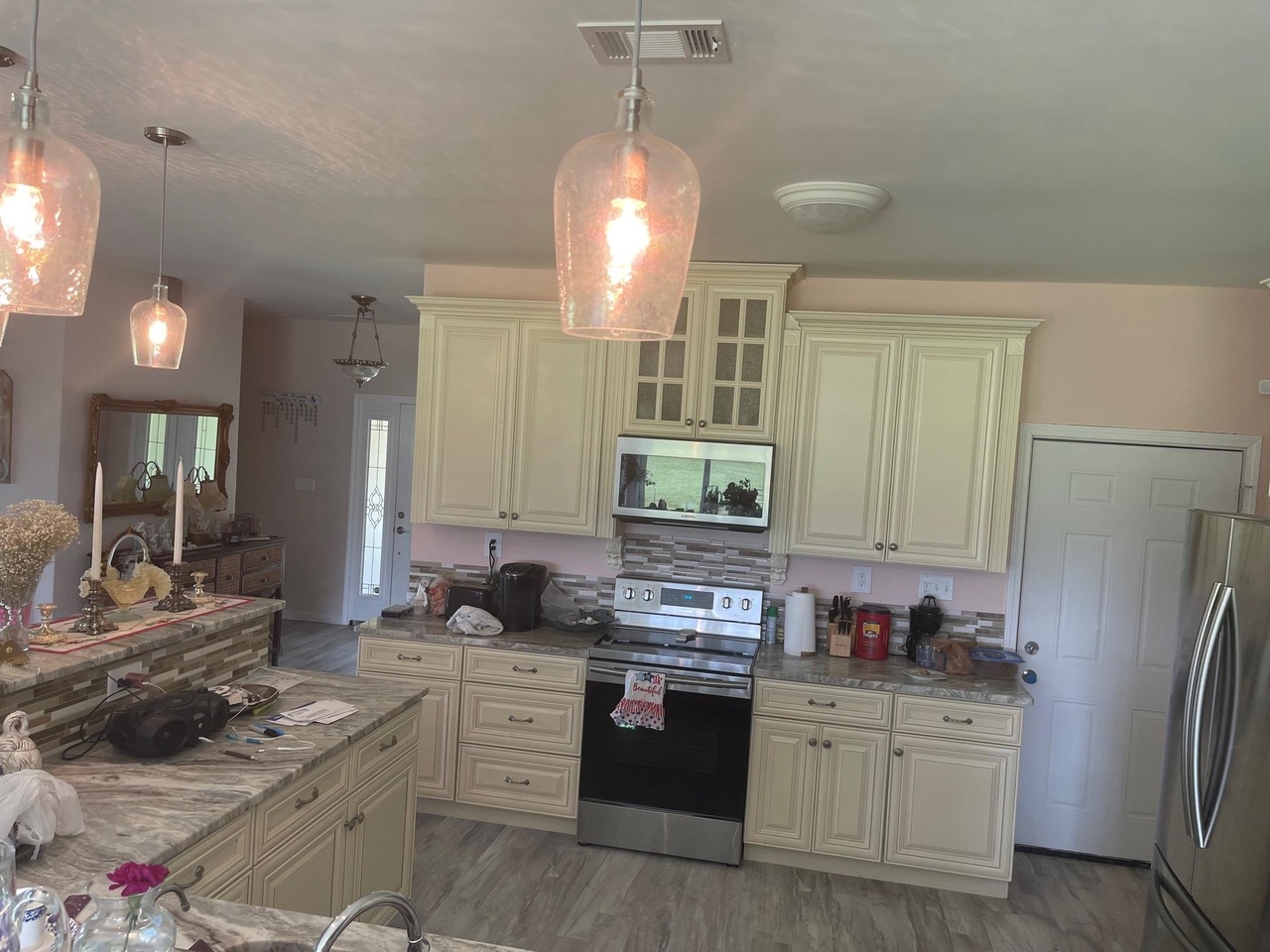 1911 Ellis Road Hogansville, GA 30230 - Photo 12 of 49 a kitchen with stainless steel appliances granite countertop a sink stove and refrigerator