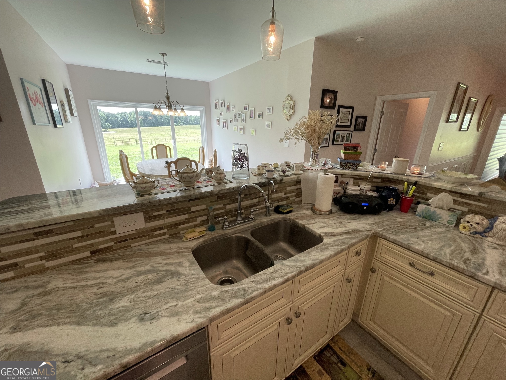 1911 Ellis Road Hogansville, GA 30230 - Photo 13 of 49 a kitchen with a sink a stove and cabinets
