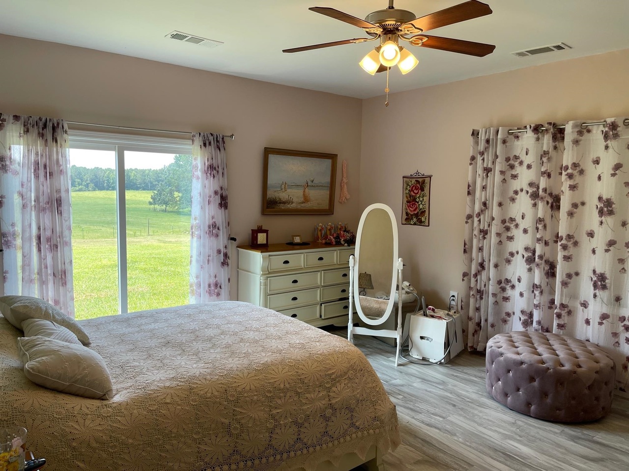 1911 Ellis Road Hogansville, GA 30230 - Photo 18 of 49 a bedroom with a bed and a chandelier