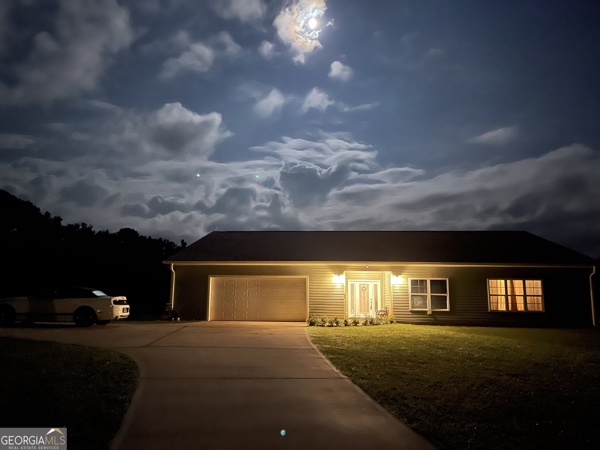 1911 Ellis Road Hogansville, GA 30230 - Photo 5 of 49 a front view of a house with a yard and garage
