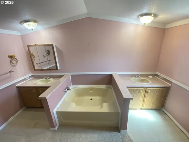 a bathroom with a tub and sink