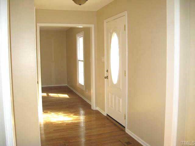 122 Stedwick Place Durham, NC 27712 - Photo 2 of 12 a view of a bathroom from a hallway