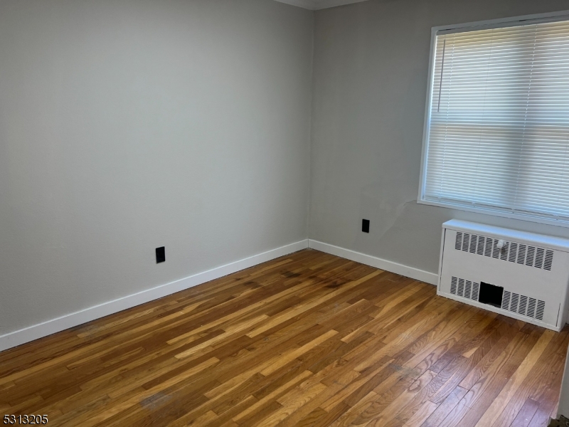49 Garfield Park Edison, NJ 08837 - Photo 5 of 10 a view of a room with wooden floor and a window