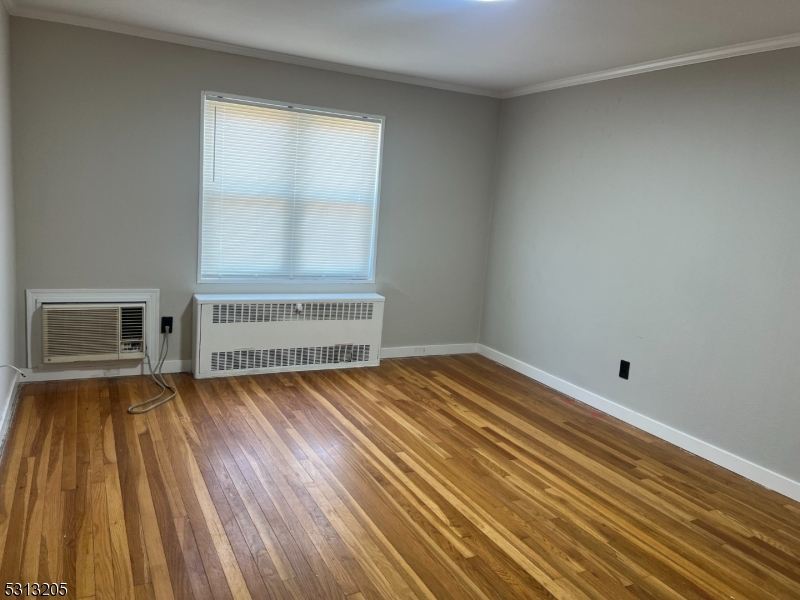 49 Garfield Park Edison, NJ 08837 - Photo 6 of 10 a view of an empty room and wooden floor