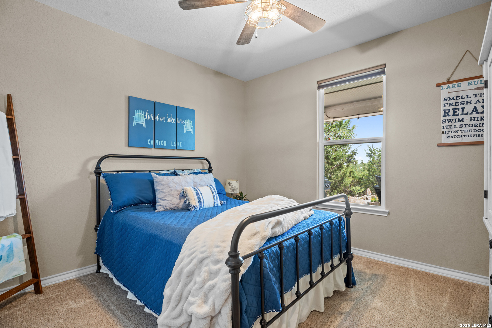 819 Primrose Path Spring Branch, TX 78070 - Photo 11 of 17 a bedroom with a bed and a window