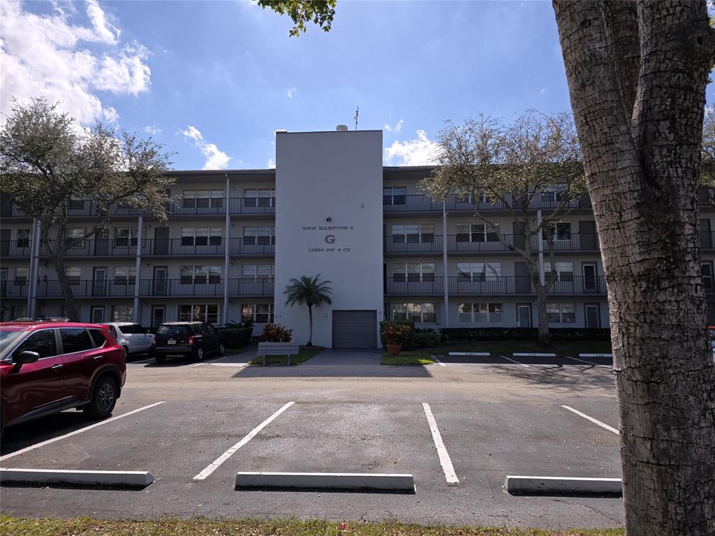 a view of a cars parked in front of a building