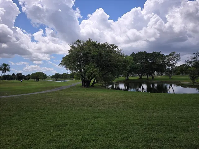 a view of an empty room with bathroom