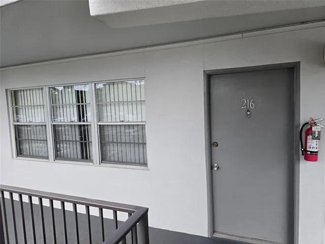 a room with furniture and a flat screen tv