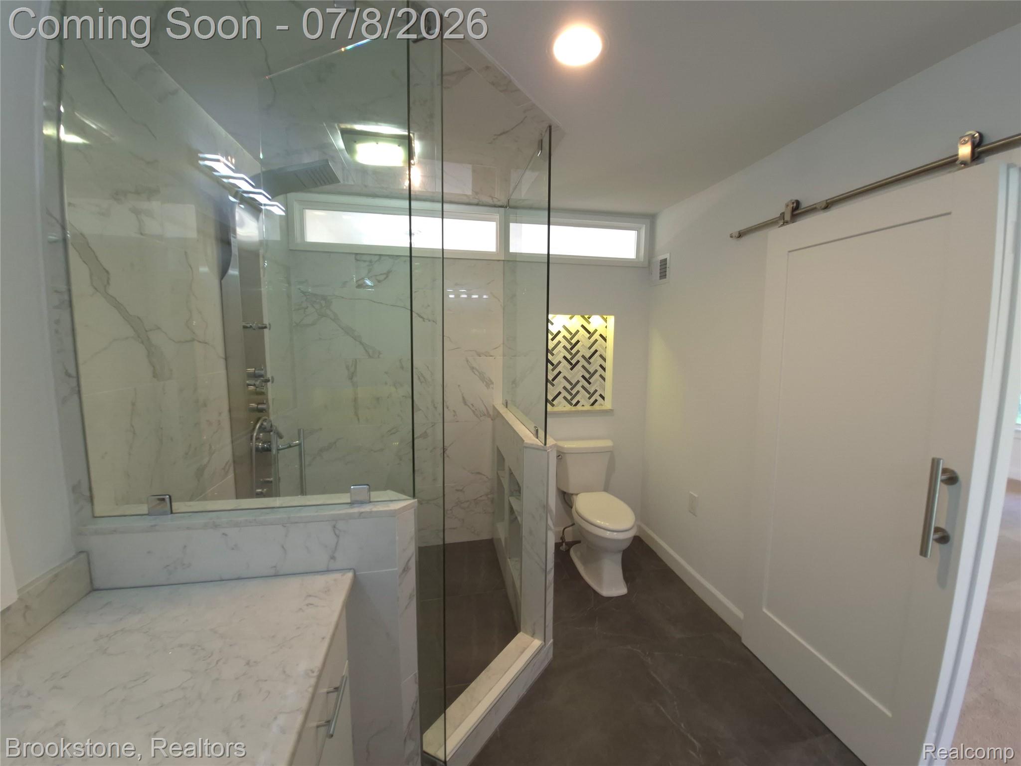 4140 South Henderson Road Davison, MI 48423 - Photo 49 of 98 Walk-in shower with a glass enclosure, white marble-look wall tiling, and a multi-function shower panel