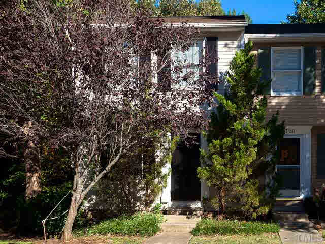 7722 Bernadette Lane Raleigh, NC 27615 - Photo 1 of 23 front view of a house with a tree