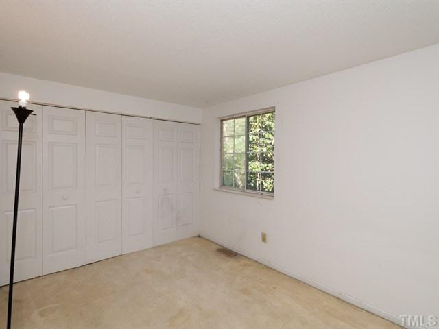 7722 Bernadette Lane Raleigh, NC 27615 - Photo 13 of 23 an empty room with a window