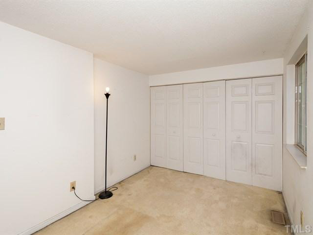 7722 Bernadette Lane Raleigh, NC 27615 - Photo 14 of 23 a view of an empty room