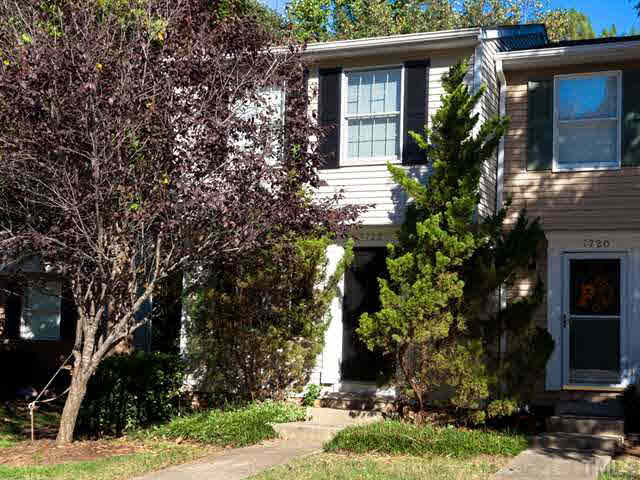 7722 Bernadette Lane Raleigh, NC 27615 - Photo 23 of 23 a front view of a house with a yard