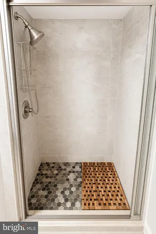 a bathroom with a glass door shower