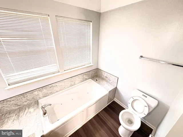 a bathroom with a bathtub and a sink