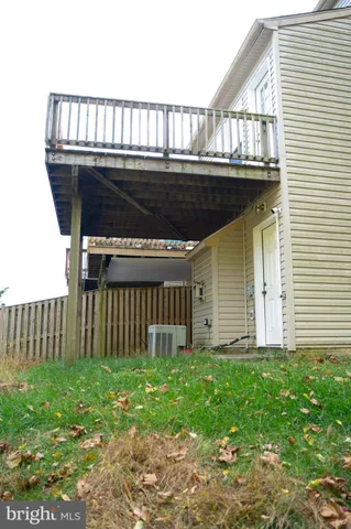 a view of house with backyard