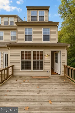 a front view of a house with a large window