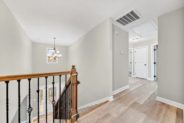a view of a hallway with windows