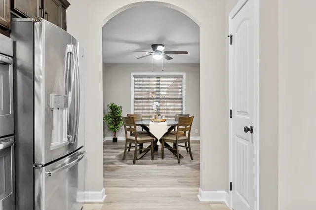 a view of a dining room with furniture window and wooden floor