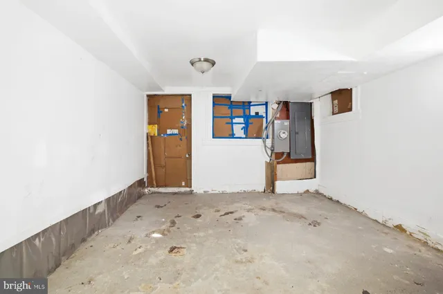 an empty room with bookshelf