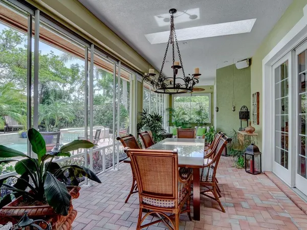 a view of a dining room with furniture window and outside view