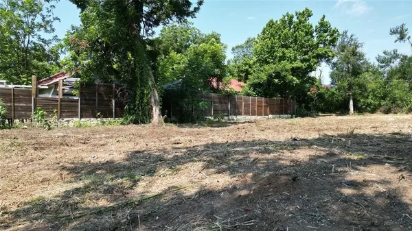 a swimming pool with wooden fence